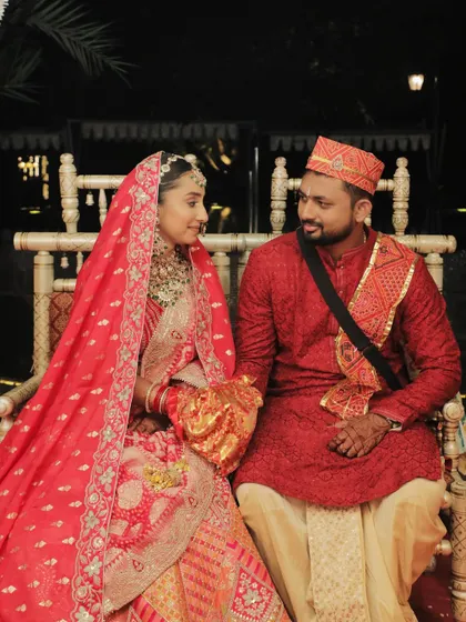 A quiet moment together during the ceremony. The couple looks serene and happy, and the bride's makeup enhances her natural beauty.