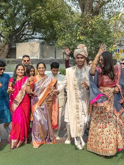 The whole family dancing together to welcome the groom.