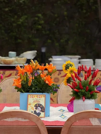 A duplicate of image 293, showing the creative and colorful centerpieces that adorned the dining tables.