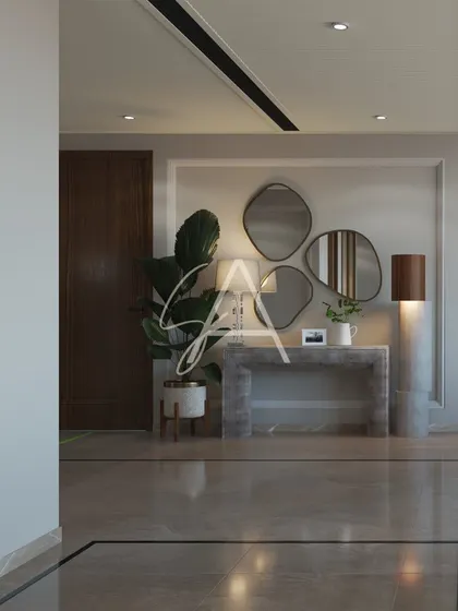 The entryway console sets the tone for the home. Here, a collection of organic-shaped mirrors and a minimalist concrete table create a striking first impression that is both artistic and modern.