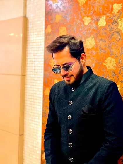 A stylish downward glance, showing off the details of the textured bandhgala jacket.
