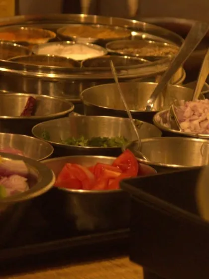 A close-up of the fresh ingredients and spice box used in our Ayurvedic cooking sessions. We use a variety of herbs and spices to create meals that are balanced and flavorful.