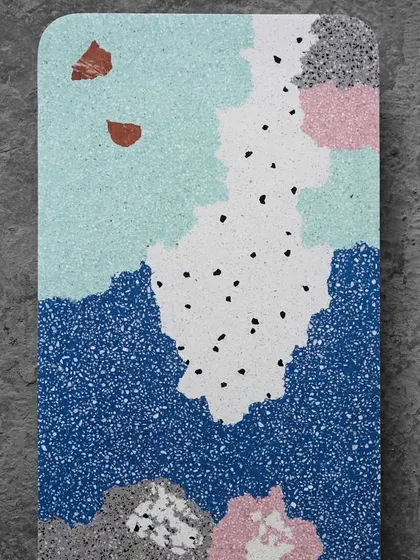A top-down view of a multicolor terrazzo sample, resembling an abstract painting. This design can be used for tabletops, wall art, or even unique flooring tiles.