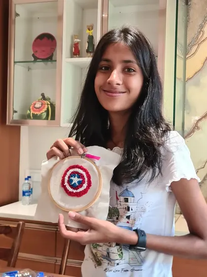 Another young participant proudly holding her Captain America shield. It's a popular choice among the younger crafters in my classes.