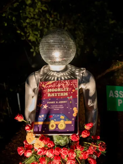 A "Moonlit Rhythm" sign, held by a mannequin with a disco ball head. This quirky signage perfectly captured the cosmic, party-centric theme of the sangeet night.