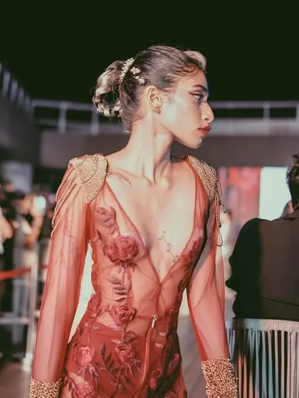 A model on the runway at our URBN fashion night. The event provides a platform for designers to showcase their collections to a live audience in a vibrant, energetic setting.