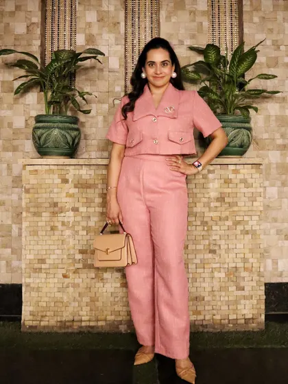 This tweed co-ord set is the perfect example of modern power dressing. It's structured and professional, yet the color and fabric add a touch of glamour, making it versatile enough for the boardroom or after-work events.
