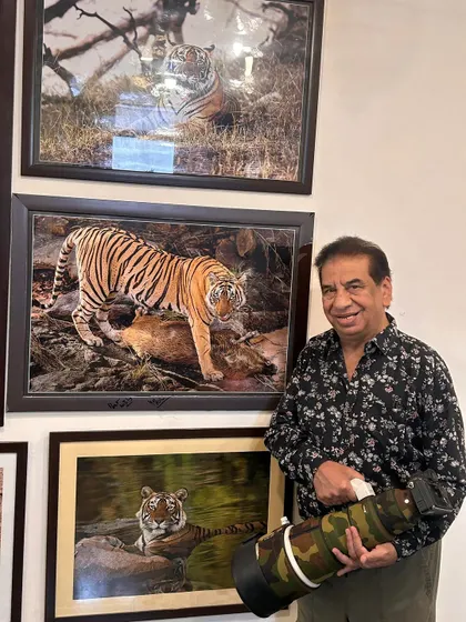 Another one of my framed photographs on display. Holding my 400mm lens next to the print shows the power of this gear to capture images worthy of being hung on a wall.