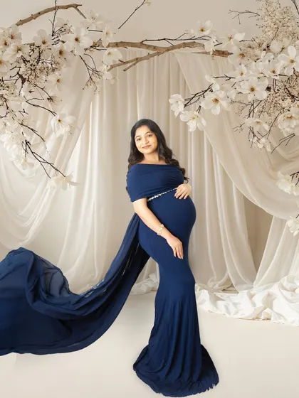 An example of my AI background enhancement. I took the original studio portrait and placed it in a dreamy, floral archway for a completely different feel.