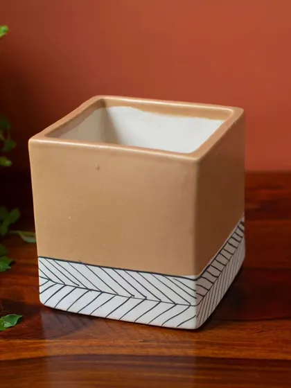 The square shape of the Marley planter gives it a contemporary feel, while the hand-painted details add a personal, artisanal touch.
