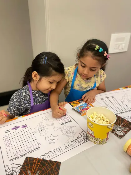 The fun doesn't stop at baking. I always bring along themed activities like these Halloween word searches to keep the kids engaged.