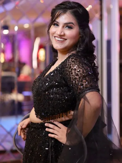 A beautiful portrait shot, capturing her joy and the elegance of her party look.