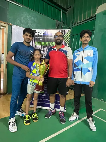 Ananya Sriram with her coaches after winning the Inter-House Badminton Tournament at DPS Bengaluru North. We support our players in all their competitions.