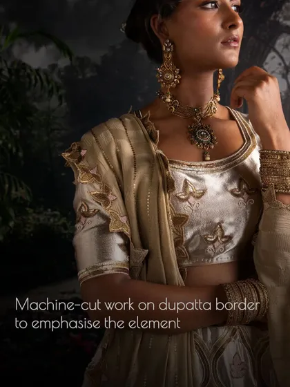 The dupatta border is machine-cut to emphasize the intricate design elements, adding another layer of sophistication to the overall bridal ensemble.