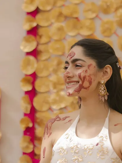 The pure joy of a Haldi ceremony! The bride's infectious smile, even while being playfully covered in paste, is the essence of this fun-filled tradition. I create a comfortable space for these uninhibited moments.