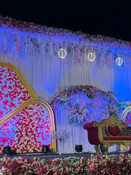An angled view of the modern red and white floral stage, showing the depth and texture of the design.