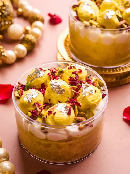 My Rasmalai Tres Leches is where Indian tradition meets global indulgence. I soak a moist vanilla cake in a saffron and cardamom milk blend, layer it with Belgian white chocolate mousse, and top it with baby rasmalais and pistachios.