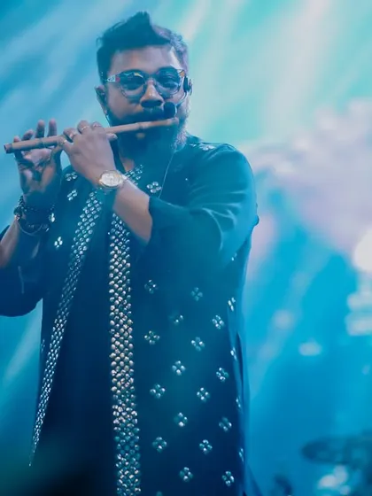 A close-up of our flutist, his melody weaving through the powerful sound of the band.