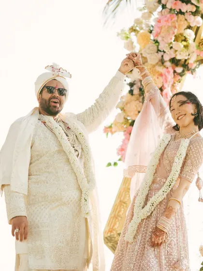 A joyful and playful moment between the bride and groom during their ceremony. Their happy dance captures their personalities perfectly.