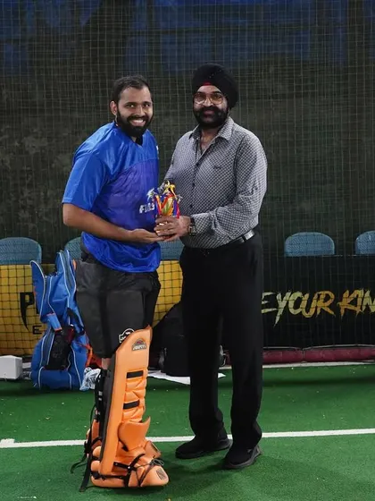 A player receives an award for his performance. We believe in recognizing individual excellence as part of our team's success.