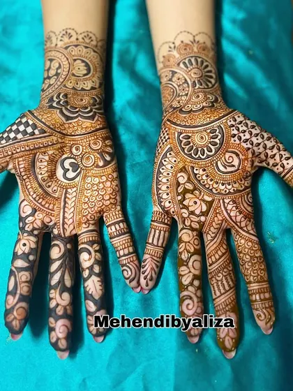 Modern geometric motifs for a unique look. This design plays with negative space and combines checkerboard fills with bold, dark finger designs.