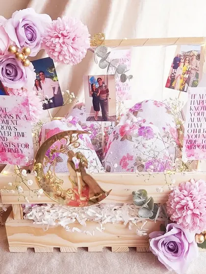 This anniversary hamper is all about celebrating memories. We filled a pinewood crate with photos of the couple, romantic quotes, and a beautiful moon-shaped decor piece.