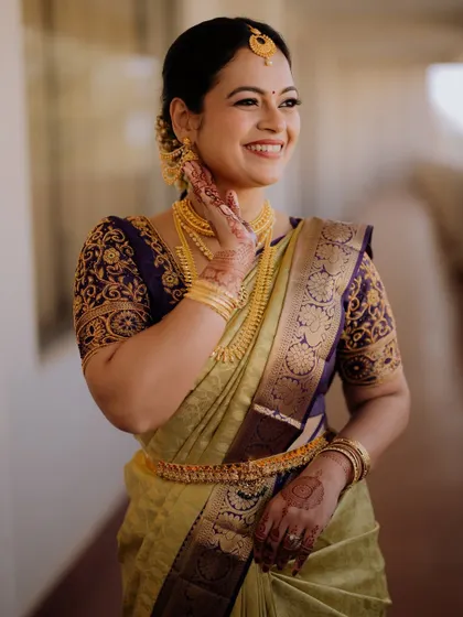 Captured in a moment of happiness, her makeup is designed to look fresh and natural. I used a light hand to create a glowing complexion and softly defined eyes, letting her natural beauty shine.