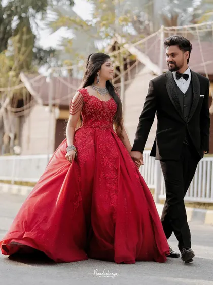 The grand walk as a newly married couple. This photo captures the elegance of their reception attire and the confident joy as they step into their future together.