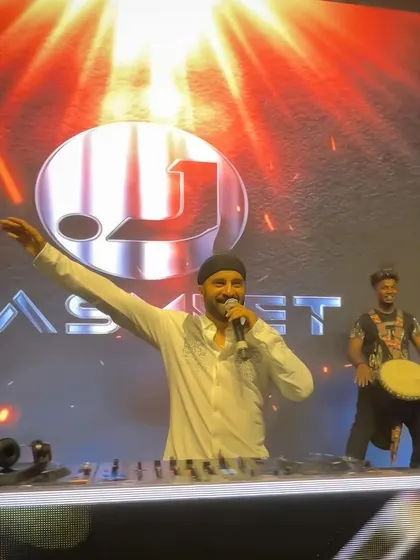 On stage with a djembe player, hyping the crowd. The live element adds so much to the performance.