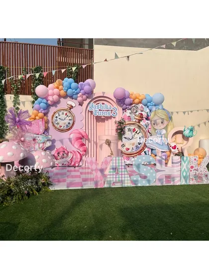 The full outdoor setup for the Alice in Wonderland party, showing the scale and vibrant colors.