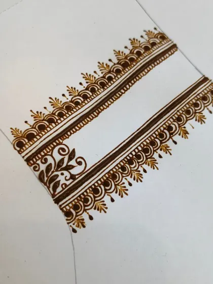 A close-up of a practice strip. I often work on small sections like this to perfect a particular border or filler pattern until the muscle memory is perfect.