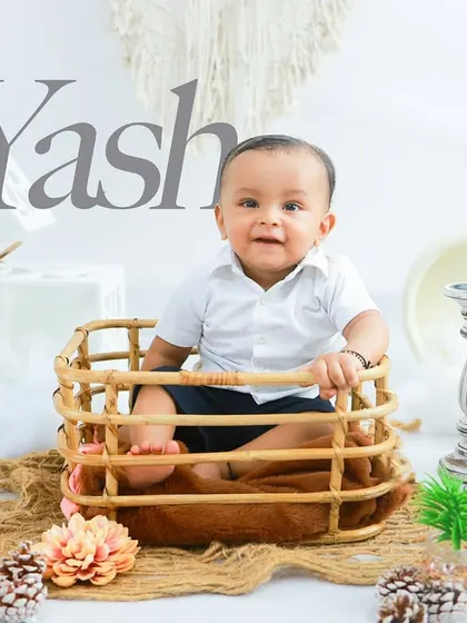 A beautiful and minimalist boho-themed sitter session. The neutral colors and natural textures create a timeless and elegant portrait that highlights the baby's natural beauty.