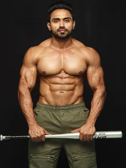 Holding the bat, ready for whatever comes next. Strength isn't just for the gym.
