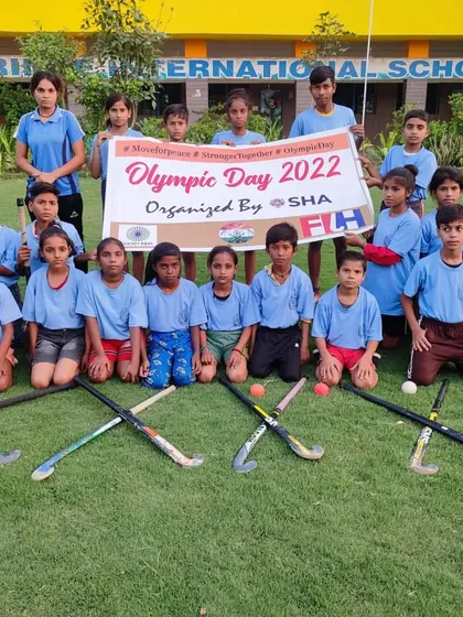 The next generation of hockey players, holding the Olympic Day banner with pride. We organize these events to inspire our youngest athletes.