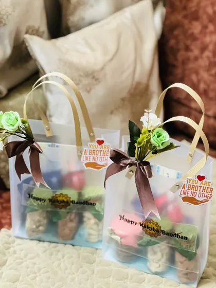 A pair of beautifully decorated Rakhi gift bags, perfect for gifting to brothers.
