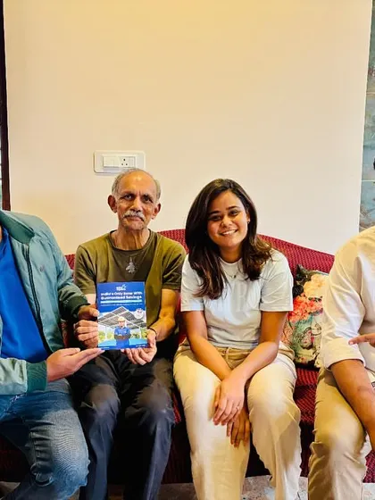 Our team with a happy family, celebrating their decision to invest in a sustainable future.