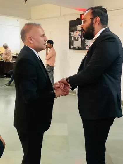 A handshake congratulating a colleague on his election victory. These connections across the bar are invaluable.