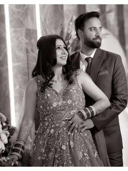 A classic black and white portrait of the couple. This timeless style emphasizes their expressions and the elegant details of their outfits, creating a photo that will never go out of style.