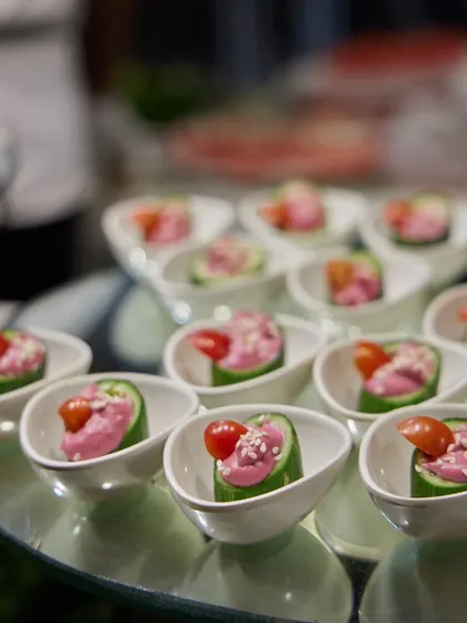 Cucumber cups filled with a creamy beetroot hummus and topped with a cherry tomato. This is a refreshing, healthy, and elegant appetizer option for any occasion.