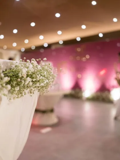 A detail shot of the event space, with delicate baby's breath flowers accenting the table linens, showing our attention to the smallest touches.