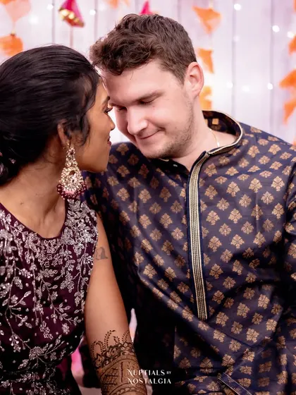 A tender moment between the cross-cultural couple at their Mehendi.
