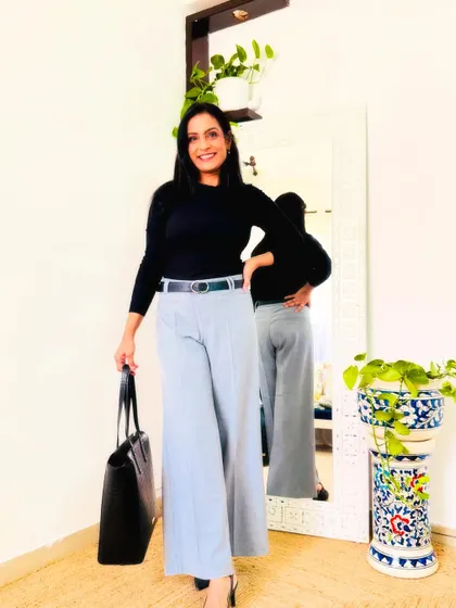 These light grey wide-leg trousers from Myntra are a great workwear staple. They are comfortable and look very professional when paired with a simple black top.