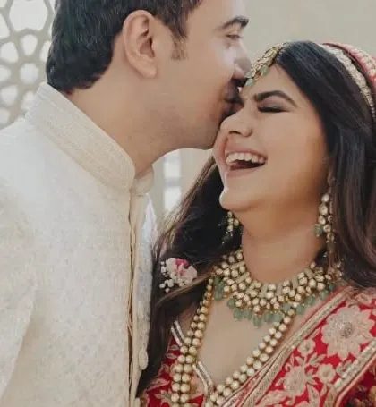 A close-up of the couple's infectious laughter and joy on their wedding day.