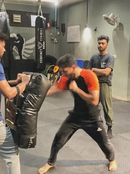 This student is unleashing a powerful combination on the pads. This drill builds cardiovascular endurance and striking power simultaneously.