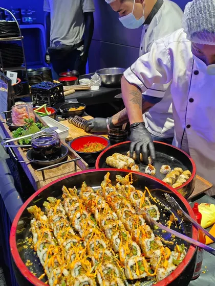 Our chefs meticulously prepare fresh sushi rolls at a live station during the Mercedes-EQ launch. This interactive offering allows guests to enjoy high-quality, hand-rolled sushi made right before their eyes.