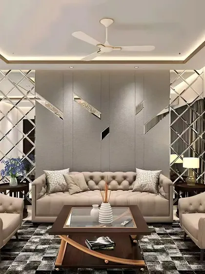 This elegant living room uses mirrored wall panels to create a sense of spaciousness. The tufted beige sofa and armchairs add a touch of classic comfort.