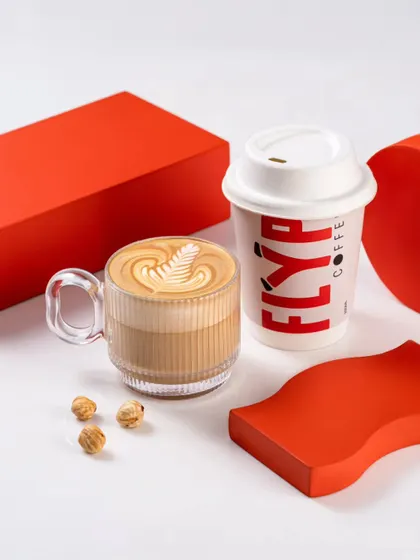 A similar shot to the one above, showing different coffee preparations and accompaniments for Flyp Coffee.