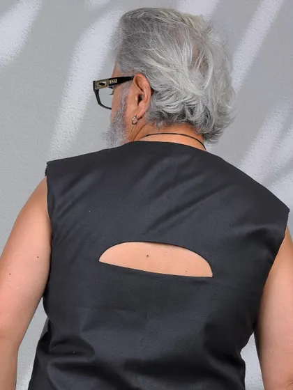 A close-up detail shot of the cutout on the back, showing the garment's unique design features.