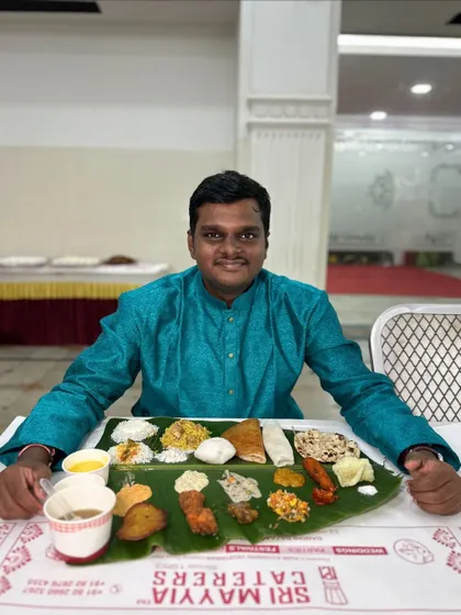A guest ready to enjoy the full spread. We take pride in seeing the joy our food brings to your family and friends.
