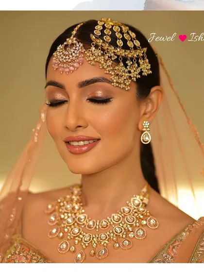 Another beautiful portrait of the bride with her eyes closed, highlighting the soft glam makeup and the stunning combination of the polki necklace and headpiece.